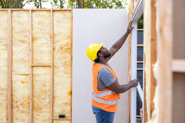 African American contractor installing a sliding door while building a house - construction industry concepts